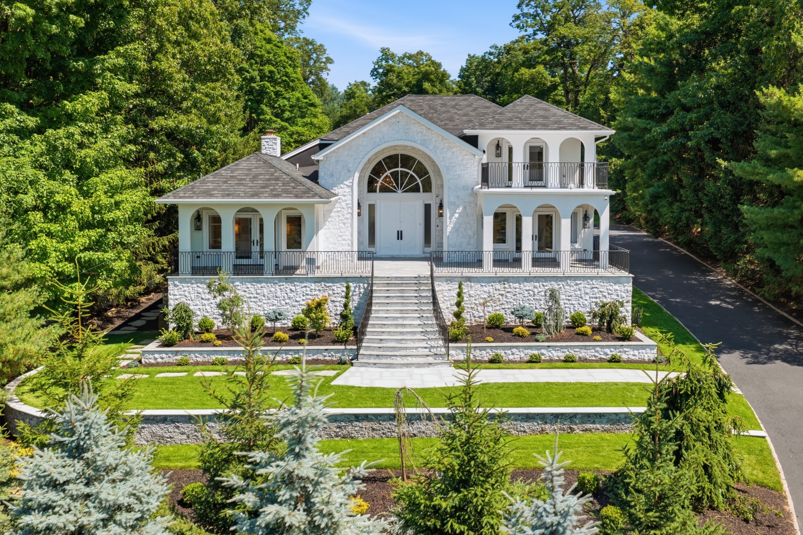244 Park Avenue — white stone-and-stucco facade with arched porticos