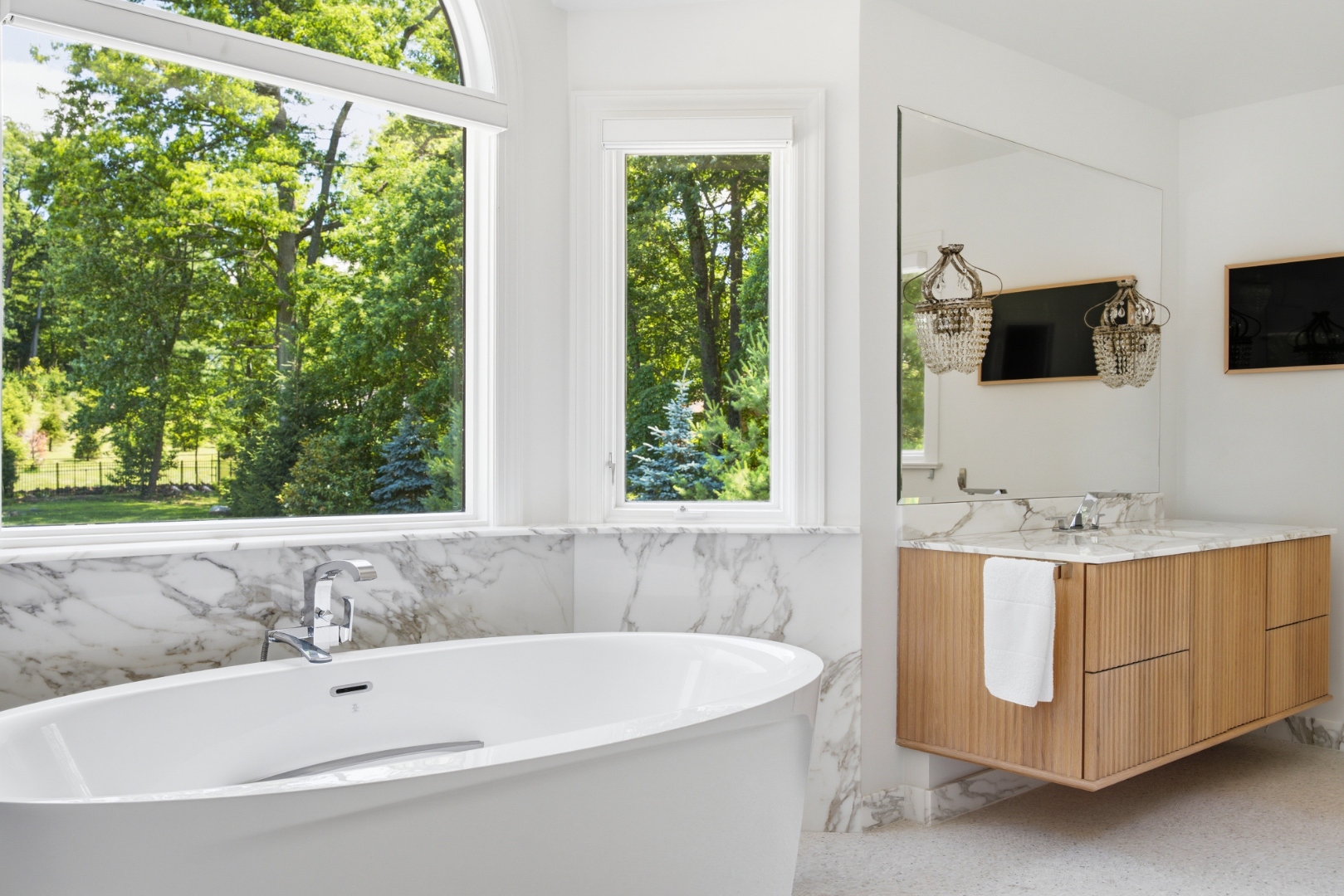 Primary bath — Catalan Italian marble and floating vanities