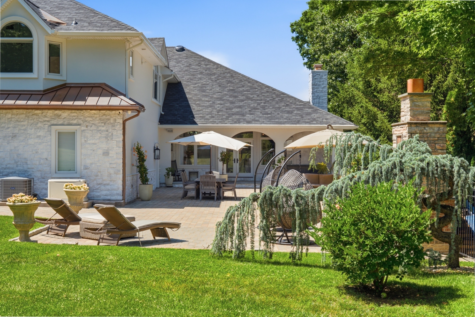 Rear of home — outdoor terrace and lawn